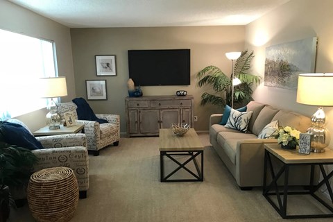 a living room with a couch and a tv